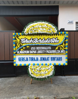 Papan Bunga Duka di Wek Ii